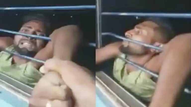 Bihar thief dangles train window passengers grab